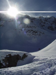 Sun and snowy mountain