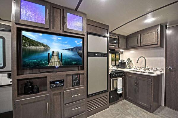 Crossroads Sunset Trail Travel Trailer Kitchen and TV